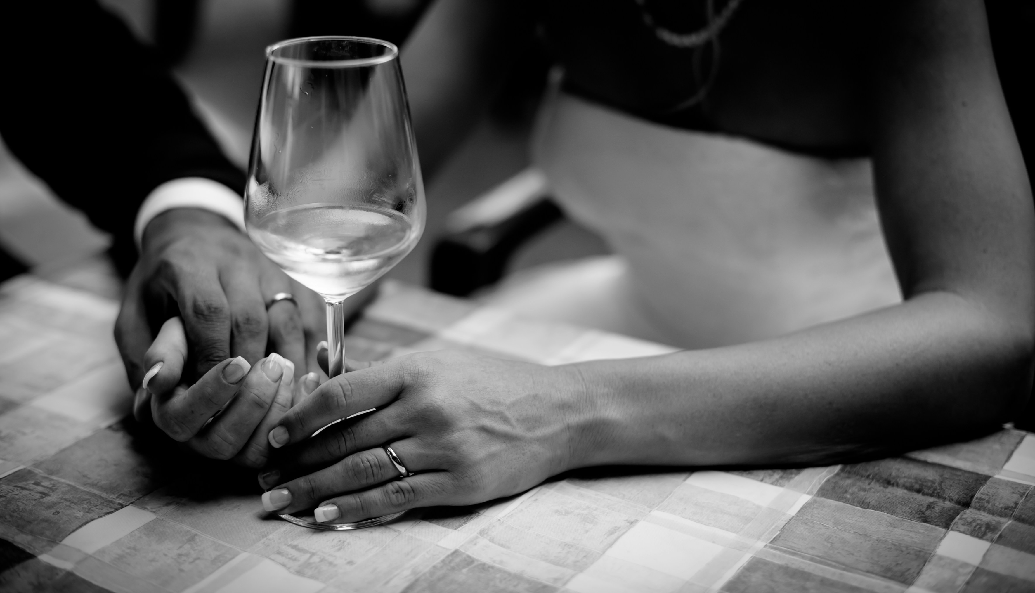 Elegant black and white photograph of a couple at dinner