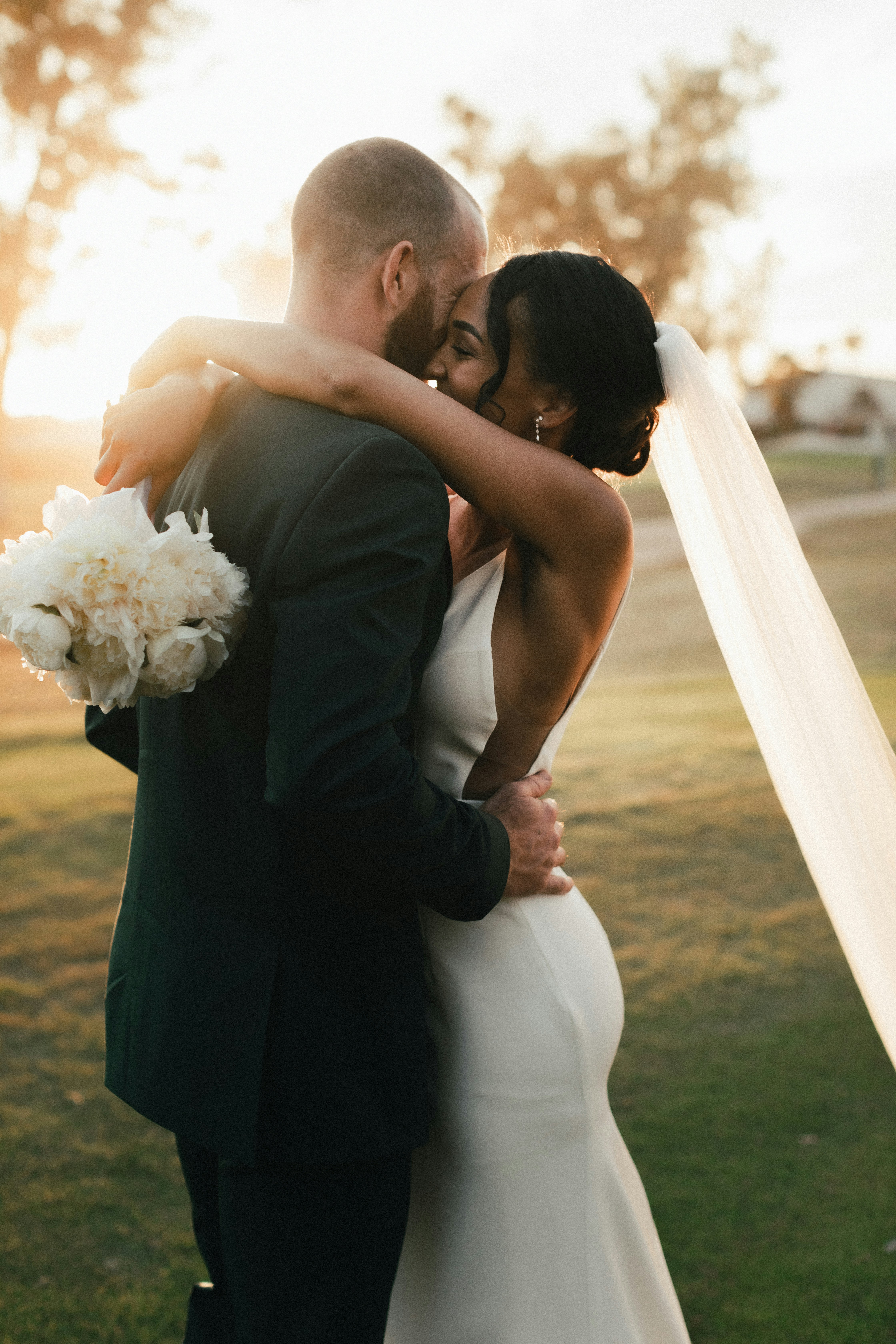 Couple embrace during wedding portraits